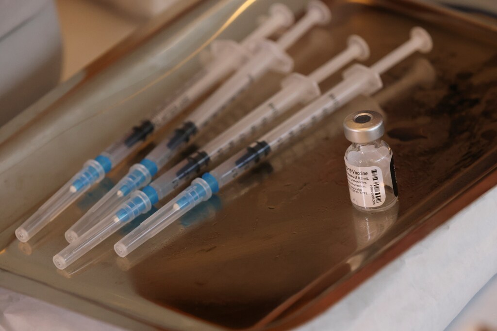 Doses of Pfizer/BioNTech coronavirus disease (COVID-19) vaccine are seen in a try as the Chilean sanitary authority starts a vaccination campaign for people from 12 to 17 years old in Santiago, Chile June 23, 2021. REUTERS/Ivan Alvarado - RC2G6O9UIXGG
