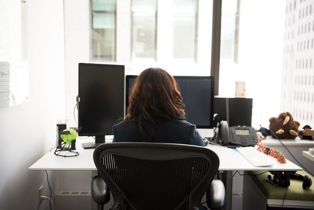 image of a woman working at a computer
