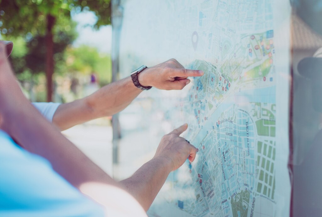 here are two people using a map to plan their route