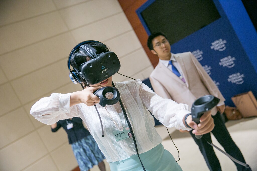Participants experiencing Virtual Reality at the World Economic Forum - Annual Meeting of the New Champions in Tianjin, People's Republic of China 2016.
