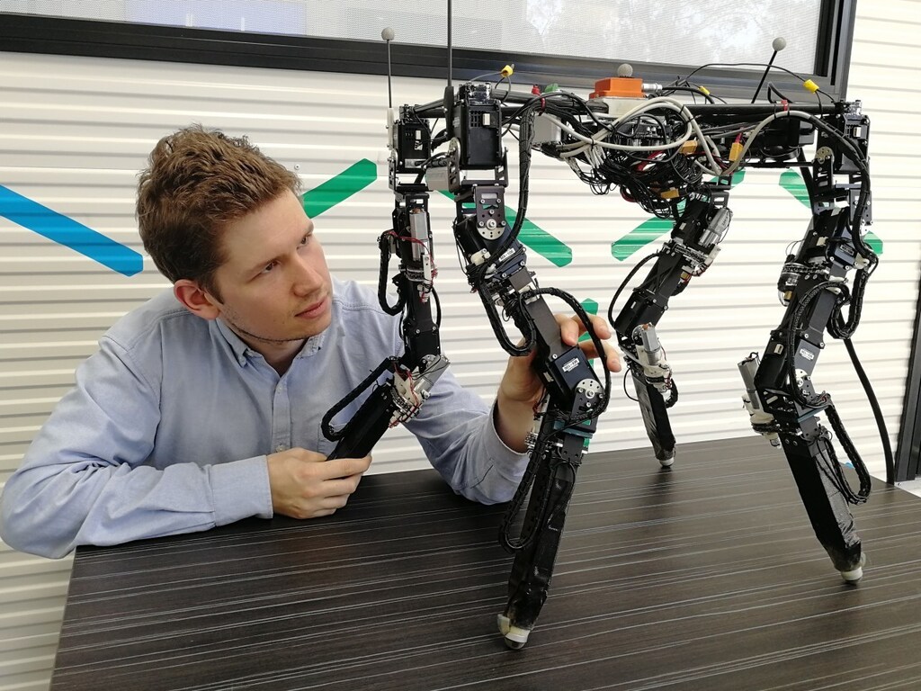 Lead researcher Tønnes Nygaard with Dyret the four-legged robot