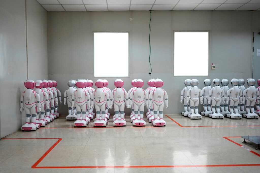 iPal social robots, designed by AvatarMind, are seen at an assembly plant in Suzhou, Jiangsu province, China July 4, 2018. Designed to offer education, care and companionship to children and the elderly, the 3.5-feet tall humanoid robots come in two genders and can tell stories, take photos and deliver educational or promotional content. Picture taken July 4, 2018. REUTERS/Aly Song - RC1E55FB7F00