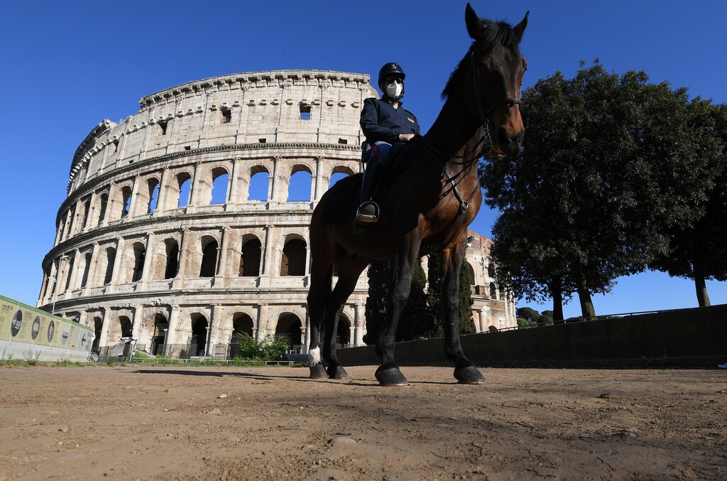 An Italian mounted police officer is seen in front of the Colosseum, as the spread of the coronavirus disease (COVID-19) continues, in Rome, Italy, April 26, 2020.