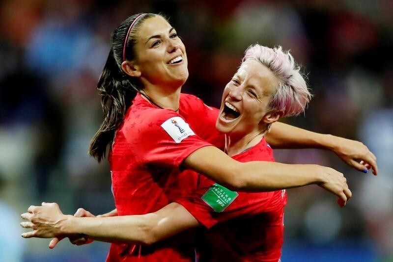 Soccer Football - Women's World Cup - Group F - United States v Thailand - Stade Auguste-Delaune, Reims, France - June 11, 2019 Alex Morgan of the U.S. celebrates scoring their twelfth goal with Megan Rapinoe REUTERS/Christian Hartmann TPX IMAGES OF THE DAY - RC1A31B35EA0