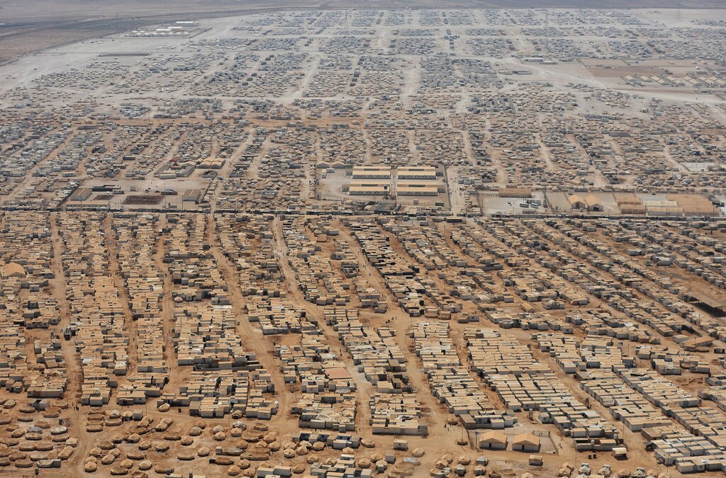 An aerial view shows the Zaatari refugee camp, near the Jordanian city of Mafraq July 18, 2013. U.S. Secretary of State John Kerry spent about 40 minutes with half a dozen refugees who vented their frustration at the international community's failure to end Syria's more than two-year-old civil war, while visiting the camp that holds roughly 115,000 Syrian refugees in Jordan about 12 km (eight miles) from the Syrian border. REUTERS/Mandel Ngan/Pool