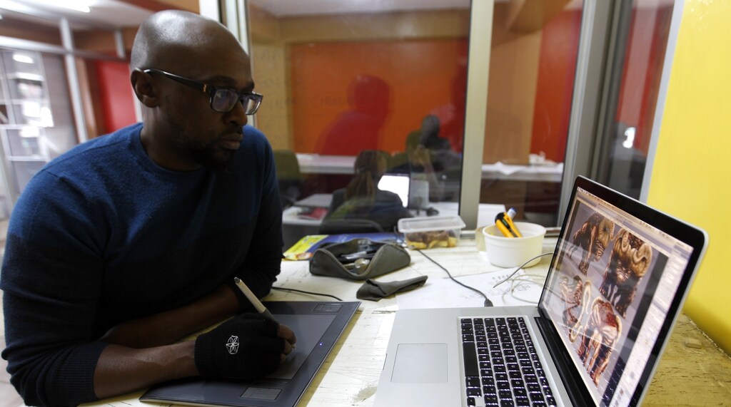 Mwaura Kirore, a creative director at Planet Rackus, works on MA3Racer, a 2D mobile game inside his studio in Kenya's capital Nairobi, July 15, 2014.