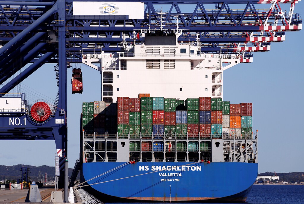 A crane unloads containers from a ship at the Port Botany Container terminal in Sydney, Australia July 6, 2017. REUTERS/David Gray - RC1AC9183E60