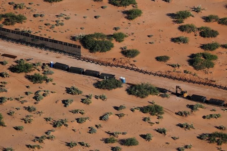 Construction on the border wall with Mexico (top) is shown in New Mexico near Sunland Park, New Mexico, U.S. June 18, 2018. REUTERS/Mike Blake
