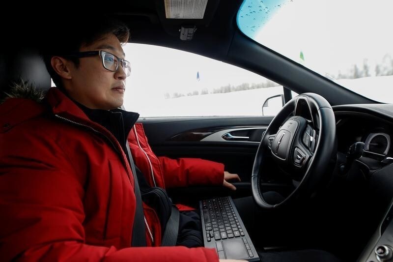Software engineer Steven Han demonstrates a self-driving car at the Renesas Electronics autonomous vehicle test track in Stratford, Ontario, Canada, March 7, 2018.