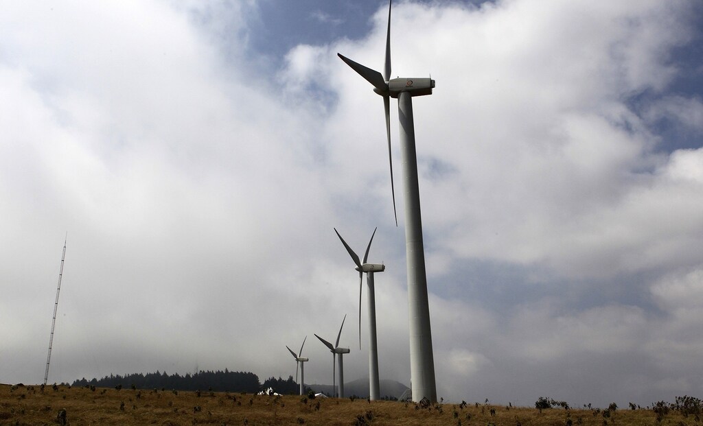 Power-generating wind turbines are seen at the Kenya Electricity Generating Company (KenGen) station in Ngong hills, about 22 km (14 miles) southwest of Kenya's capital Nairobi, September 8, 2010. Kenya's KenGen will add 20.4 megawatts of electricity from wind turbines at a single site in a move to add renewable power sources to help stabilise supplies by 2013, its energy minister said on Wednesday.