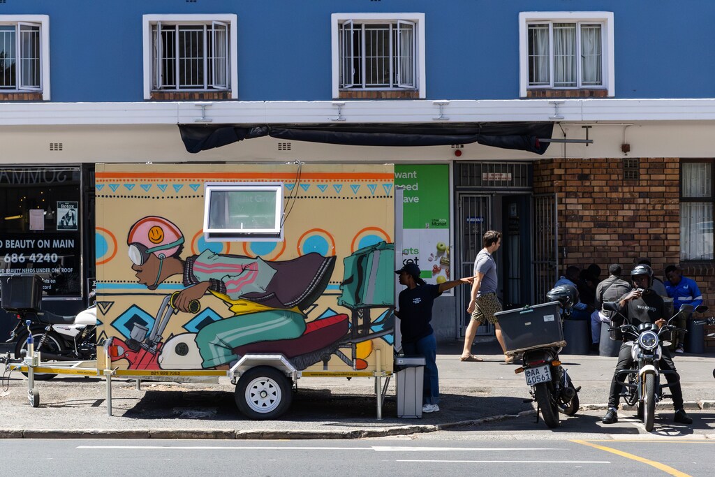 A picture of a mural of an on-demand delivery scooter: On-demand delivery in Cape Town has created opportunities as well as pressures