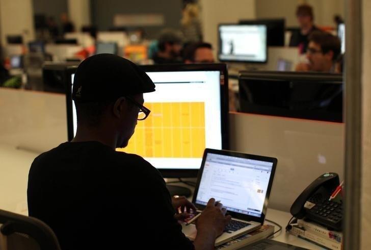 Designer Anthony Grant works on his computer at Eventbrite headquarters in the South of Market area in San Francisco, California May 25, 2012. More than ever, technology entrepreneurs, and their investors and employees, are choosing the urban charms of San Francisco over the sprawl of neighboring Silicon Valley. In the South of Market district, the nexus of the city's tech industry, rents are soaring and latte lines are lengthening - conjuring memories of the dot-com bubble of the late 1990s. Picture taken May 25. To match Feature SANFRANCISCO-SILICONVALLEY/GEEKS REUTERS/Robert Galbraith (UNITED STATES - Tags: BUSINESS SCIENCE TECHNOLOGY)