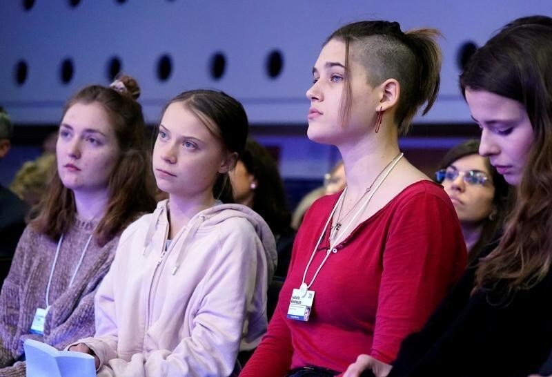 Swiss activist Loukina Tille, Swedish climate change activists Greta Thunberg and Isabelle Axelsson attend a session at the 50th World Economic Forum (WEF) annual meeting in Davos, Switzerland, January 21, 2020. Picture taken January 21, 2020. REUTERS/Denis Balibouse - RC2JLE94NJGV