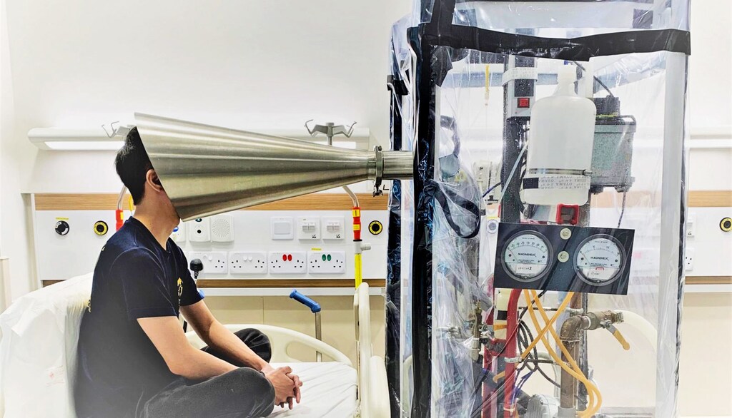 Douglas Tay demonstrates how the Gesundheit II exhalation equipment works