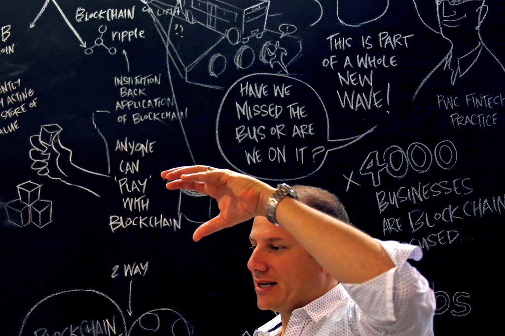 Alex Scandurra, CEO of Sydney fintech hub Stone & Chalk, talks in front of a drawing board located in the company's offices in central Sydney, Australia, April 26, 2016. REUTERS/David Gray - RTSERTZ