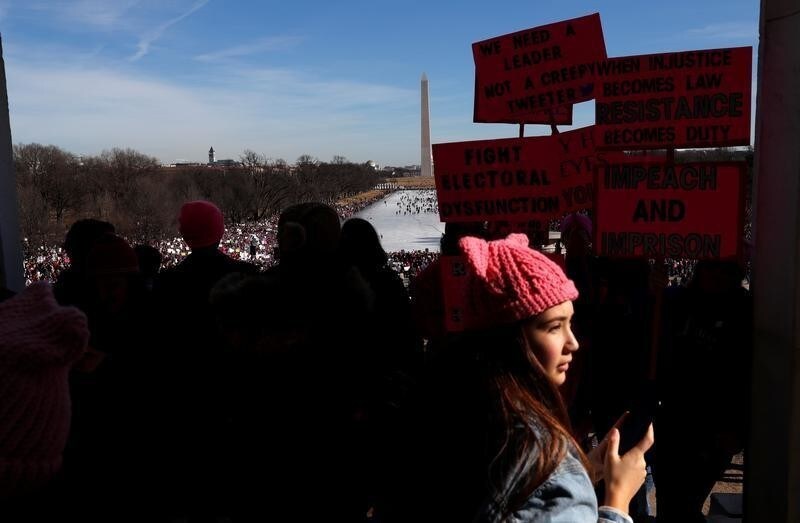 Thousands gather at the U.S. National Mall in front of the Washington Monument to participates in the Second Annual Women's March in Washington, U.S. January 20, 2018. REUTERS/Leah Millis - RC15F800F990