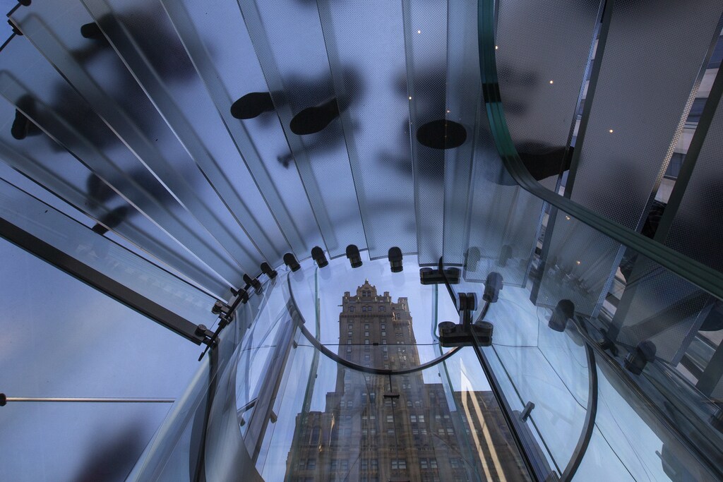 The Pierre building is seen through a stairway as customers enter the Apple retail store on Fifth Avenue in Manhattan,.