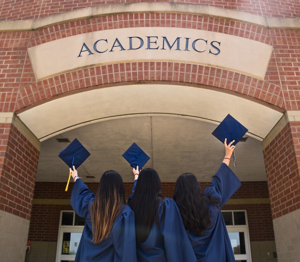 Three women graduating from university gender equality
