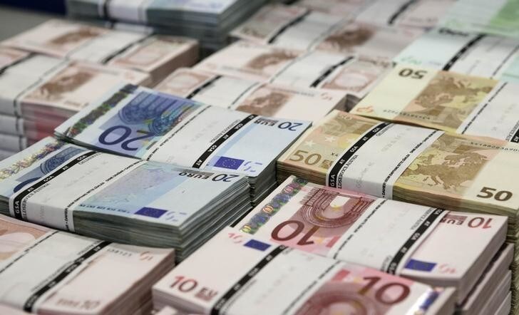 Wads of euro banknotes are stacked in a pile at the GSA Austria (Money Service Austria) company's headquarters in Vienna July 22, 2013. The GSA delivers new and collects old currency for the Austrian National Bank. REUTERS/Leonhard Foeger (AUSTRIA - Tags: POLITICS BUSINESS TPX IMAGES OF THE DAY)