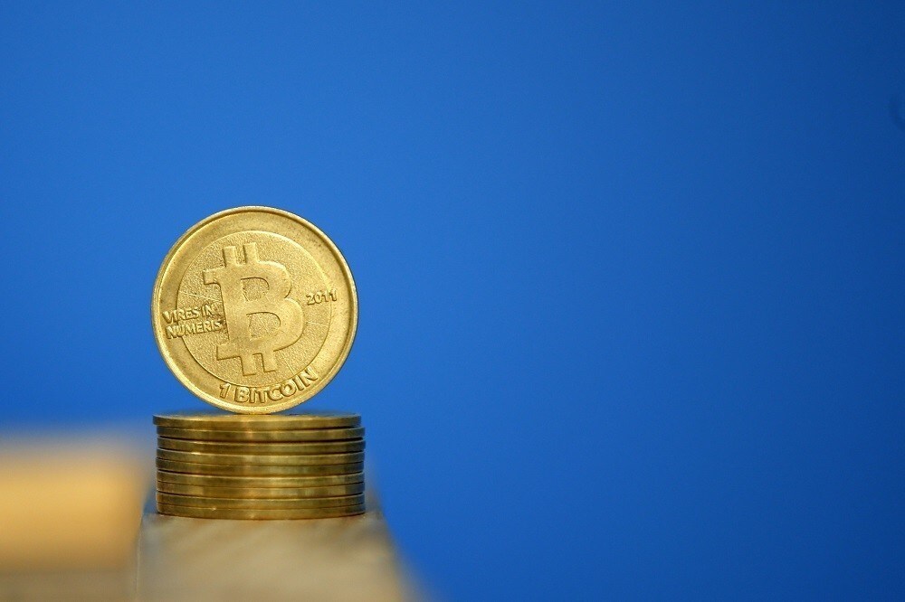 Bitcoin (virtual currency) coins are seen in an illustration picture taken at La Maison du Bitcoin in Paris July 11, 2014. French police dismantled an illegal Bitcoin exchange and seized 388 virtual currency units worth some 200,000 euros ($272,800) in the first such operation in Europe a public prosecutor said on Monday. REUTERS/Benoit Tessier (FRANCE - Tags: BUSINESS) - RTR3Y7J6