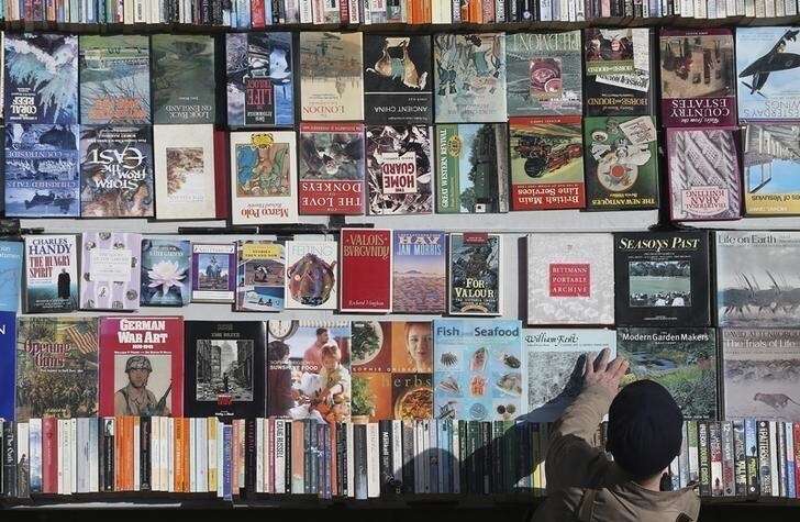 A man browses books at a stall in London, Britain May 15, 2016. REUTERS/Neil Hall
