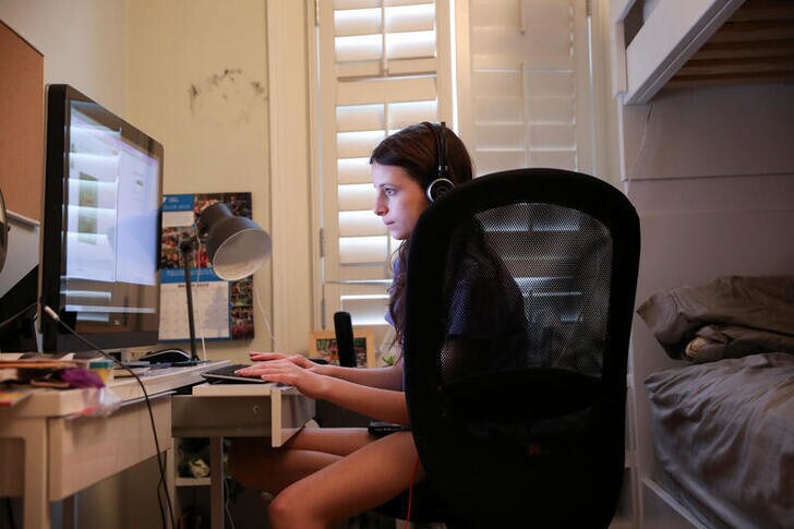 Jane Hassebroek does her schoolwork from home, which she will do for the rest of the academic year as schools in New York remain closed, during the outbreak of the coronavirus disease (COVID-19) in Brooklyn, New York, U.S., May 6, 2020. REUTERS/Caitlin Ochs