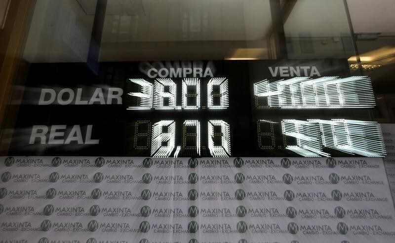 An electronic board shows currency exchange rates, in Buenos Aires' financial district in Argentina, September 4, 2018. Picture taken with zoom burst.
