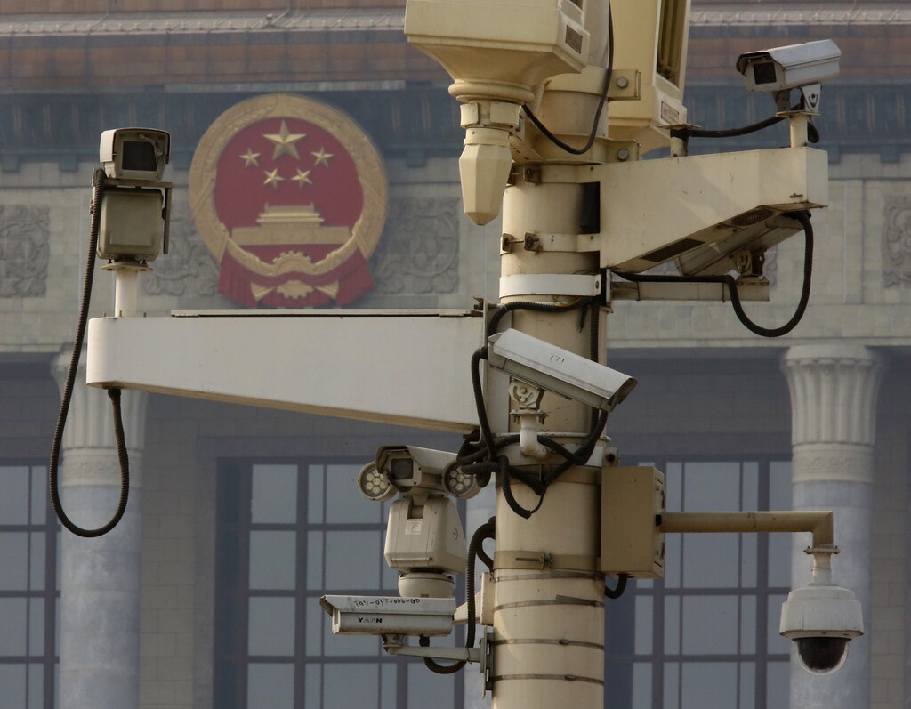 Security cameras are seen in front of the great hall of people in Tiananmen square in Beijing November 8, 2013. China's Communist Party gave an emphatic no to any political reform that may threaten its rule in a lengthy document published on Friday, the day before it starts a key meeting to set the economic agenda for the next decade.REUTERS/Kim Kyung-Hoon (CHINA - Tags: POLITICS) - RTX1551Q