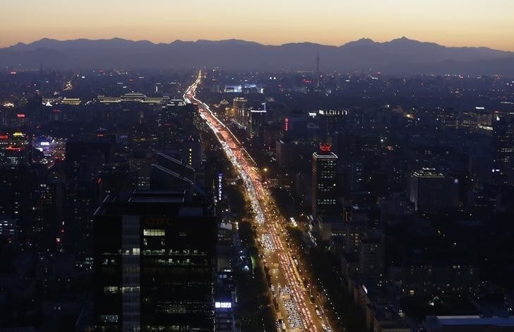 Vehicles are seen on a main avenue during the evening rush hour at sunset in Beijing September 3, 2014. REUTERS/Jason Lee (CHINA - Tags: BUSINESS ENVIRONMENT TPX IMAGES OF THE DAY TRANSPORT)