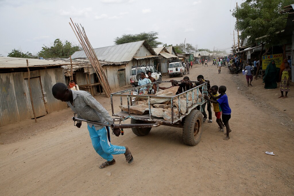 A man pulls a cart in the Kakuma refugee camp in northern Kenya, March 6, 2018. Picture taken March 6, 2018. REUTERS/Baz Ratner - RC180811C760