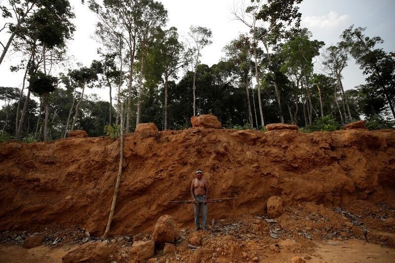 Indigenous people from the Mura tribe show a deforested area in unmarked indigenous lands, inside the Amazon rainforest near Humaita, Amazonas State, Brazil August 20, 2019. Picture taken August 20, 2019. REUTERS/Ueslei Marcelino - RC2FCF92MLIJ