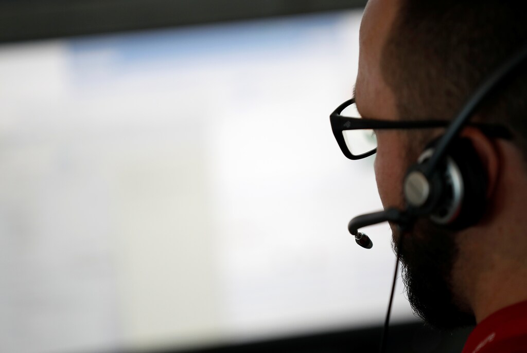 A help desk staff works on his computer as he supports alarm triggers in private homes or small business at the hub of Verisure, a provider of professionally monitored security solutions, in Angers, France, July 3, 2019.
