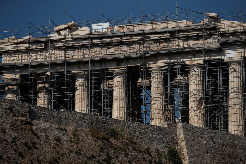 A view of the Parthenon temple and the walls of the Acropolis hill are pictured in Athens, Greece, June 24, 2019. Picture taken June 24, 2019. REUTERS/Alkis Konstantinidis - RC1504F895A0