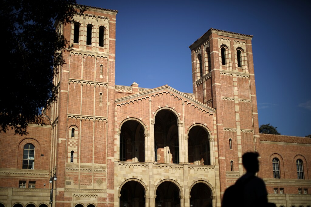 A student walks past Royce Hall on the University of California Los Angeles (UCLA) campus in Los Angeles, California, U.S. November 15, 2017. REUTERS/Lucy Nicholson - RC1C51CDA550