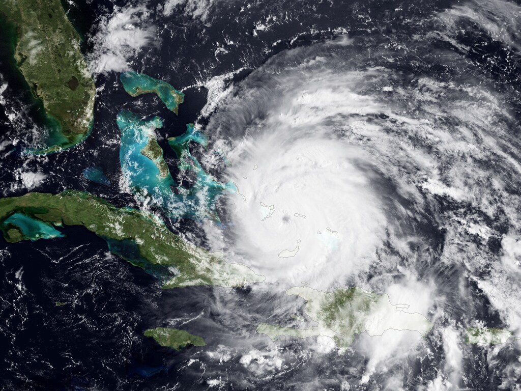 Handout image courtesy of NOAA shows a visible view of Hurricane Irene captured by the GOES-East satellite, August 24, 2011. Irene battered the Bahamas on Wednesday on a track to the North Carolina coast that forecasters say could threaten the densely populated U.S. Northeast, including New York, starting on Sunday. The hurricane, a major Category 3 storm with winds of 120 miles per hour (195 km per hour), pounded the southeast Bahamian islands with winds, rain and dangerous storm surge. REUTERS/NOAA Satellite and Information Service/Handout (ENVIRONMENT) FOR EDITORIAL USE ONLY. NOT FOR SALE FOR MARKETING OR ADVERTISING CAMPAIGNS. THIS IMAGE HAS BEEN SUPPLIED BY A THIRD PARTY. IT IS DISTRIBUTED, EXACTLY AS RECEIVED BY REUTERS, AS A SERVICE TO CLIENTS - RTR2QAB1