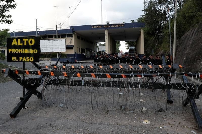 Guatemalan security forces keep watch at the Agua Caliente border with Honduras as part of Guatemala's measures to prevent Honduran migrants from crossing its territory toward the Mexican border, in Agua Caliente, Guatemala October 23, 2018.
