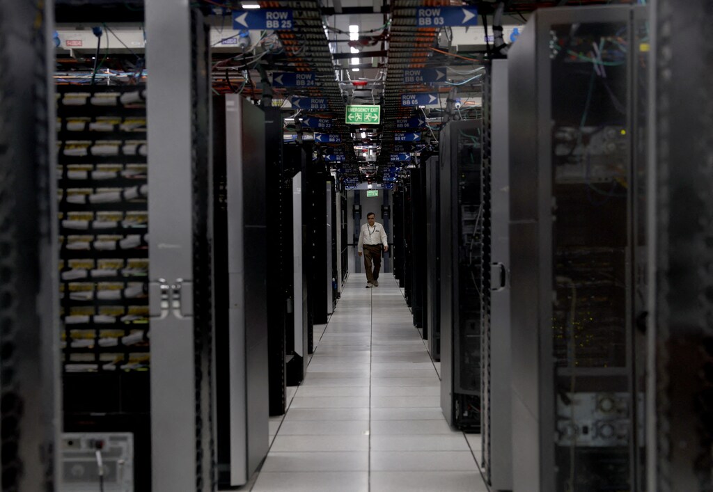 An employee walks through a data centre of Hewlett Packard Enterprise (HPE) inside its office building in Bengaluru, India.