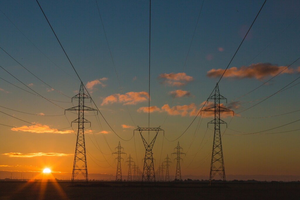 Power pylons at sunset.