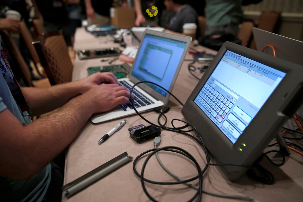 A hacker tries to access and alter data from an electronic poll book in a hacking competition in Las Vegas, Nevada.