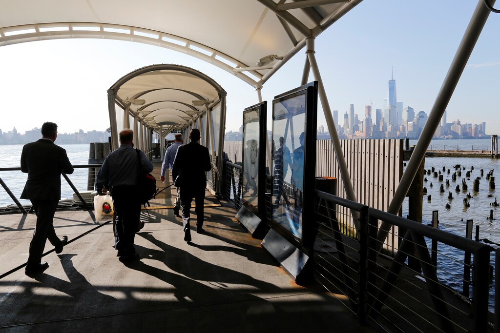 People try to commute to New York at the Hoboken Terminal in New Jersey, U.S. July 10, 2017.
