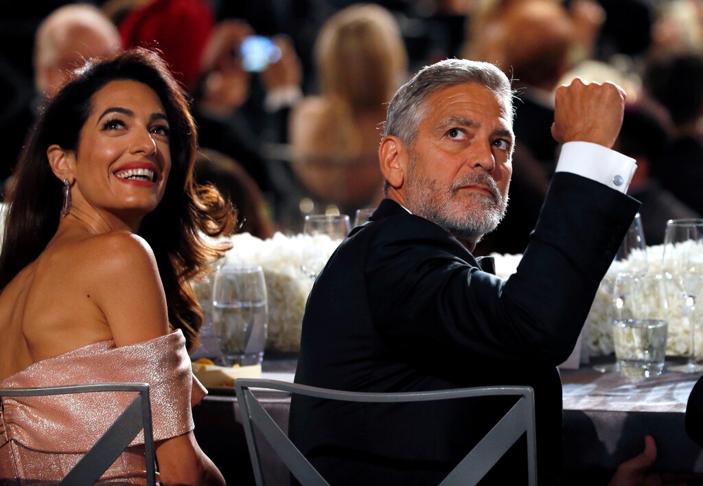 Actor George Clooney and his wife Amal attend the 46th AFI Life Achievement Award in Los Angeles, California, U.S., June 7, 2018. Picture taken June 7, 2018. REUTERS/Mario Anzuoni - RC1F4AB7ECE0