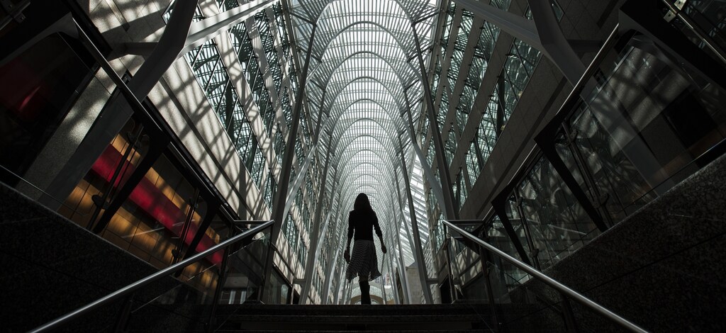 A woman walks through Brookfield Place off Bay Street, on the day of their annual general meeting for shareholders in Toronto, May 7, 2014.