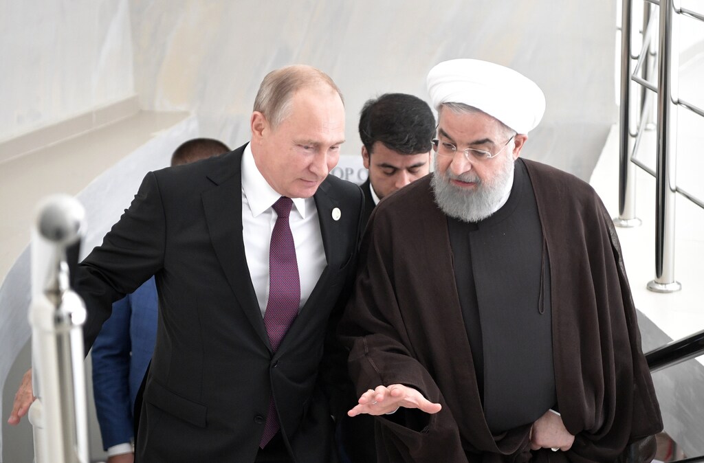 Russian President Vladimir Putin and Iranian President Hassan Rouhani attend a meeting during the Fifth Caspian Summit in Aktau, Kazakhstan August 12, 2018. Sputnik/Alexei Nikolsky/Kremlin via REUTERS ATTENTION EDITORS - THIS IMAGE WAS PROVIDED BY A THIRD PARTY. - UP1EE8C1E0PP0