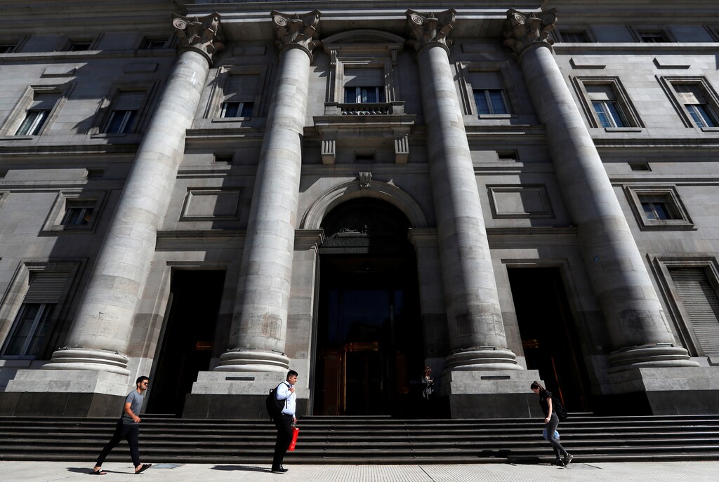 Pedestrians walk past the facade of Argentina's Banco Nacion (National Bank), in Buenos Aires, Argentina February 19, 2020. Picture taken February 19, 2020. REUTERS/Agustin Marcarian - RC214F9U4BPM