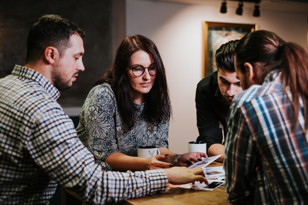 A work team gathered around a table.