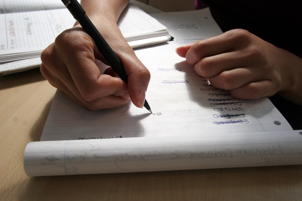 A generic picture of a woman writing. REUTERS/Catherine Benson