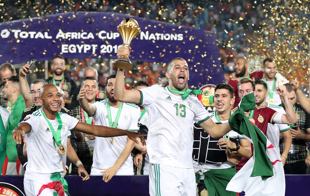 Soccer Football - Africa Cup of Nations 2019 - Final - Senegal v Algeria - Cairo International Stadium, Cairo, Egypt - July 19, 2019 Algeria's Islam Slimani celebrates with the trophy and team mates after winning the Africa Cup of Nations REUTERS/Suhaib Salem - RC18789B7170