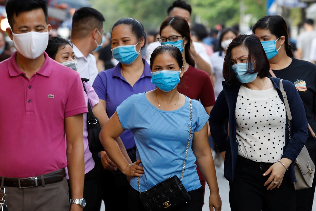 Pilgrims wear protective masks as they go to a temple on the first day of the month-long festival of the hungry ghosts, amid the coronavirus disease (COVID-19) outbreak in Hanoi, Vietnam August 19, 2020