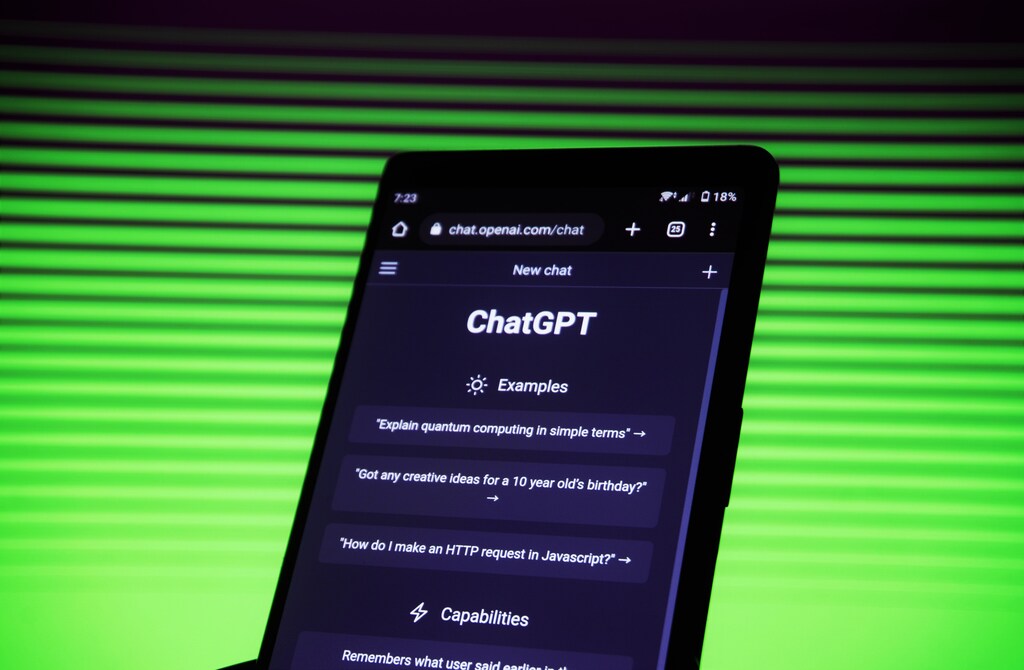 A close up of a mobile device showing ChatGPT: Generative AI could become the key driver in sectors demanding critical thinking and complex problem-solving. skills.