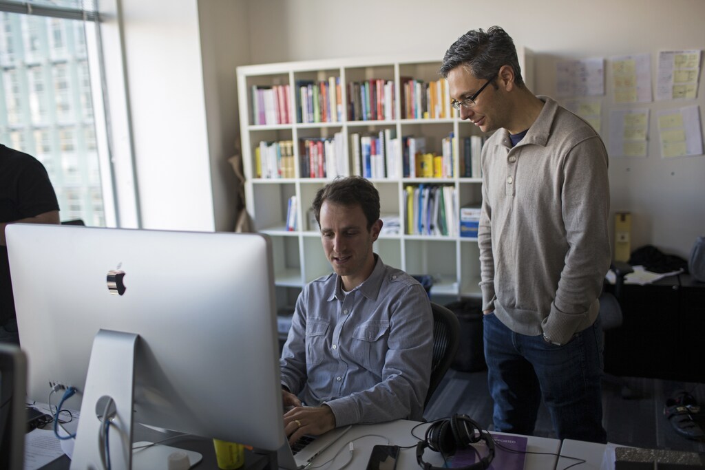 Minerva Project Principle Learning Architect Ari Bader-Natal (L) discusses work with Chief Product Office Jonathan Katzman at the company's office in San Francisco, California January 7, 2014. Offering a twist on the learn-from-anywhere convenience of Internet classes, a new university is asking freshmen to take a large leap of faith. Minerva Schools of KGI, a radically experimental university in San Francisco, is sifting through applications for its first class, starting this fall. The school is an alliance between Minerva Project, a venture-backed for-profit company, and Keck Graduate Institute, one of California's Claremont colleges. Picture taken January 7, 2014. To match Feature EDUCATION/ONLINE-MINERVA REUTERS/Stephen Lam (UNITED STATES - Tags: BUSINESS EDUCATION SCIENCE TECHNOLOGY) - RTX17HRZ